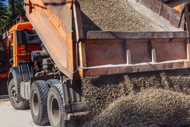 Dump truck unloading gravel